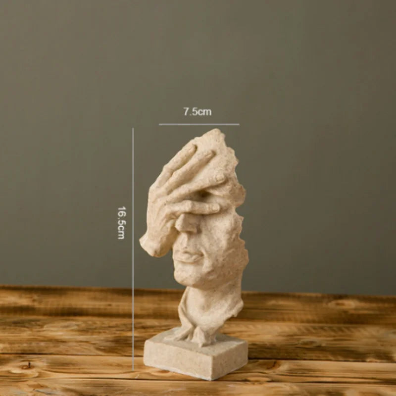 Estatueta abstrata "O Silêncio é Ouro" de resina.