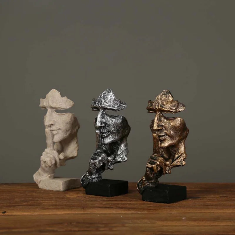 Estatueta abstrata "O Silêncio é Ouro" de resina.