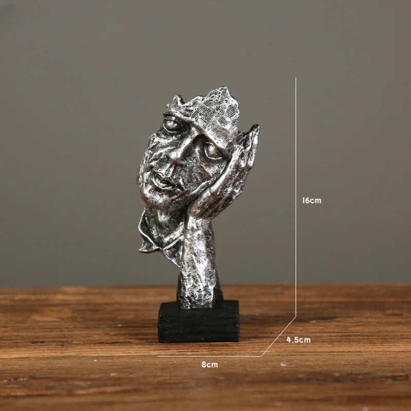 Estatueta abstrata "O Silêncio é Ouro" de resina.
