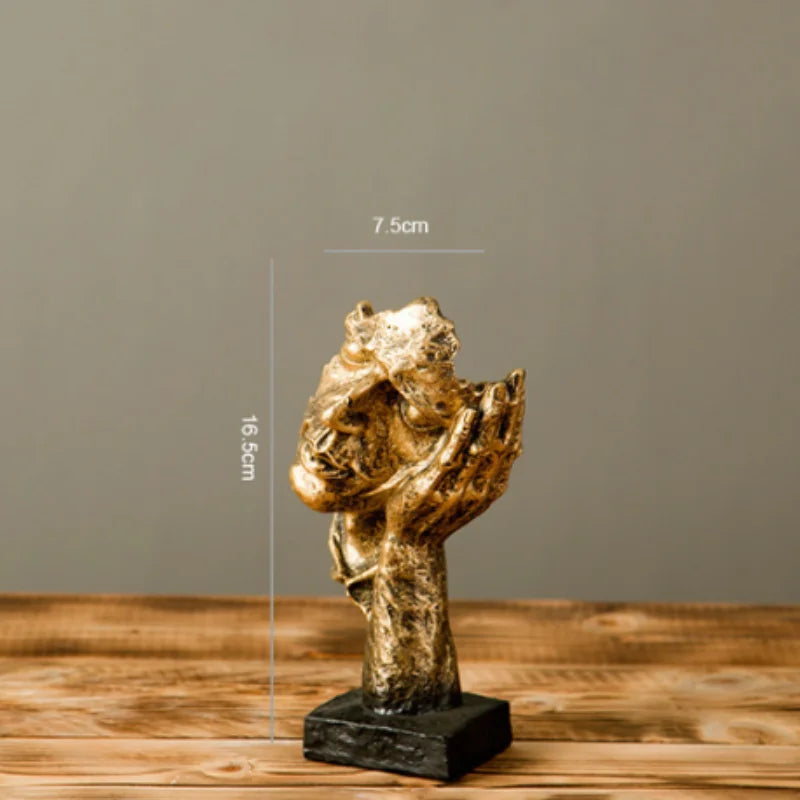 Estatueta abstrata "O Silêncio é Ouro" de resina.