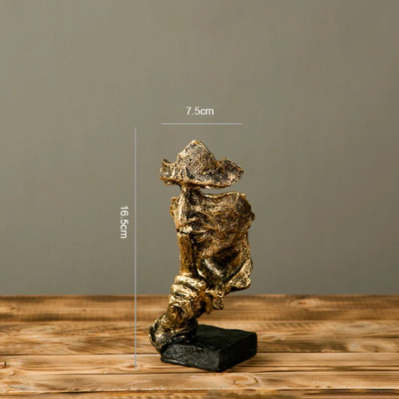 Estatueta abstrata "O Silêncio é Ouro" de resina.