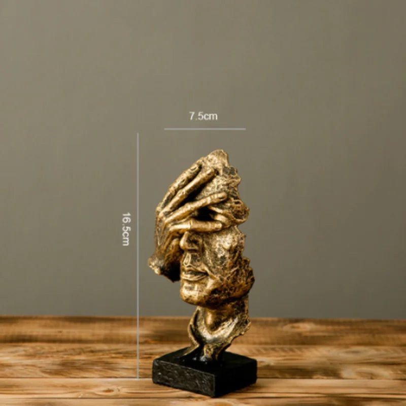 Estatueta abstrata "O Silêncio é Ouro" de resina.