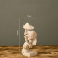 Estatueta abstrata "O Silêncio é Ouro" de resina.