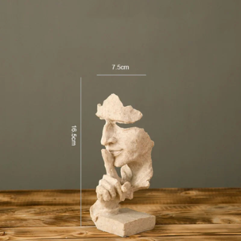 Estatueta abstrata "O Silêncio é Ouro" de resina.