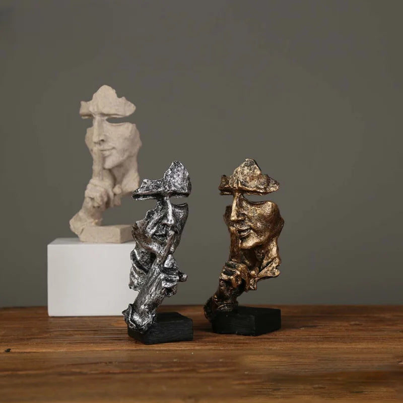 Estatueta abstrata "O Silêncio é Ouro" de resina.