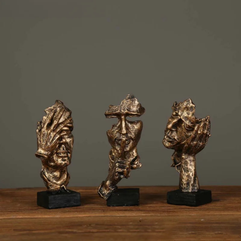 Estatueta abstrata "O Silêncio é Ouro" de resina.
